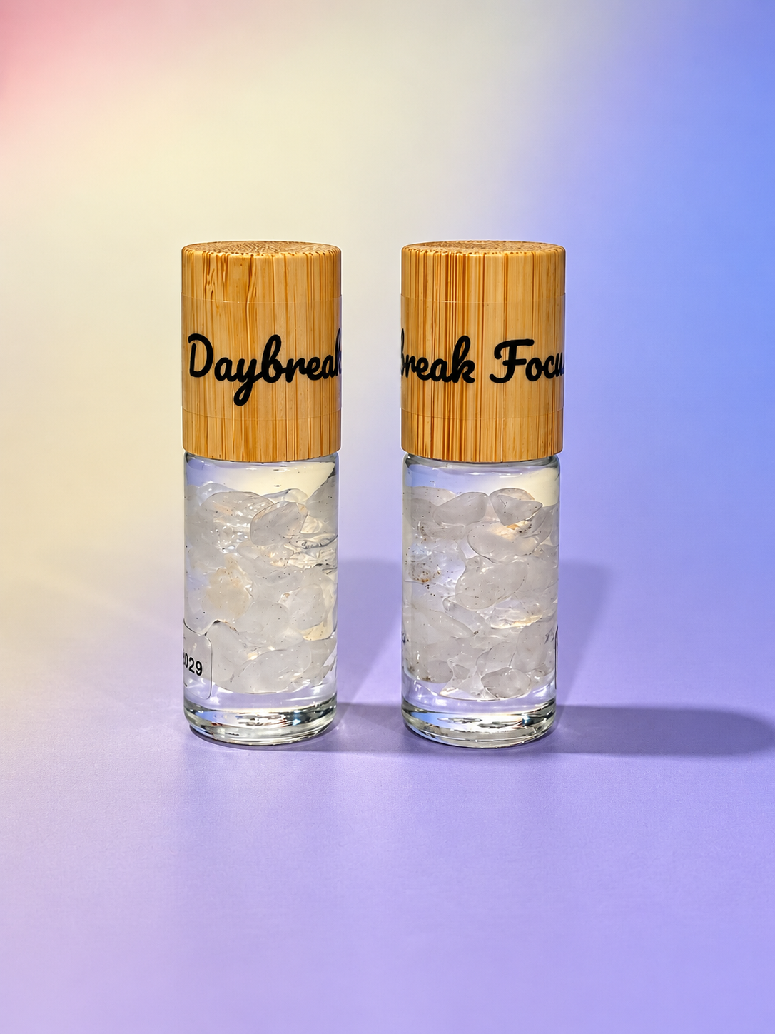 Daybreak and Focus crystal-infused essential oil roller blends with bamboo caps