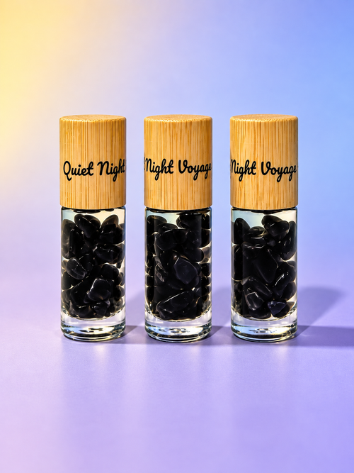 Quiet Night Voyage black crystal-infused essential oil roller blends with bamboo caps