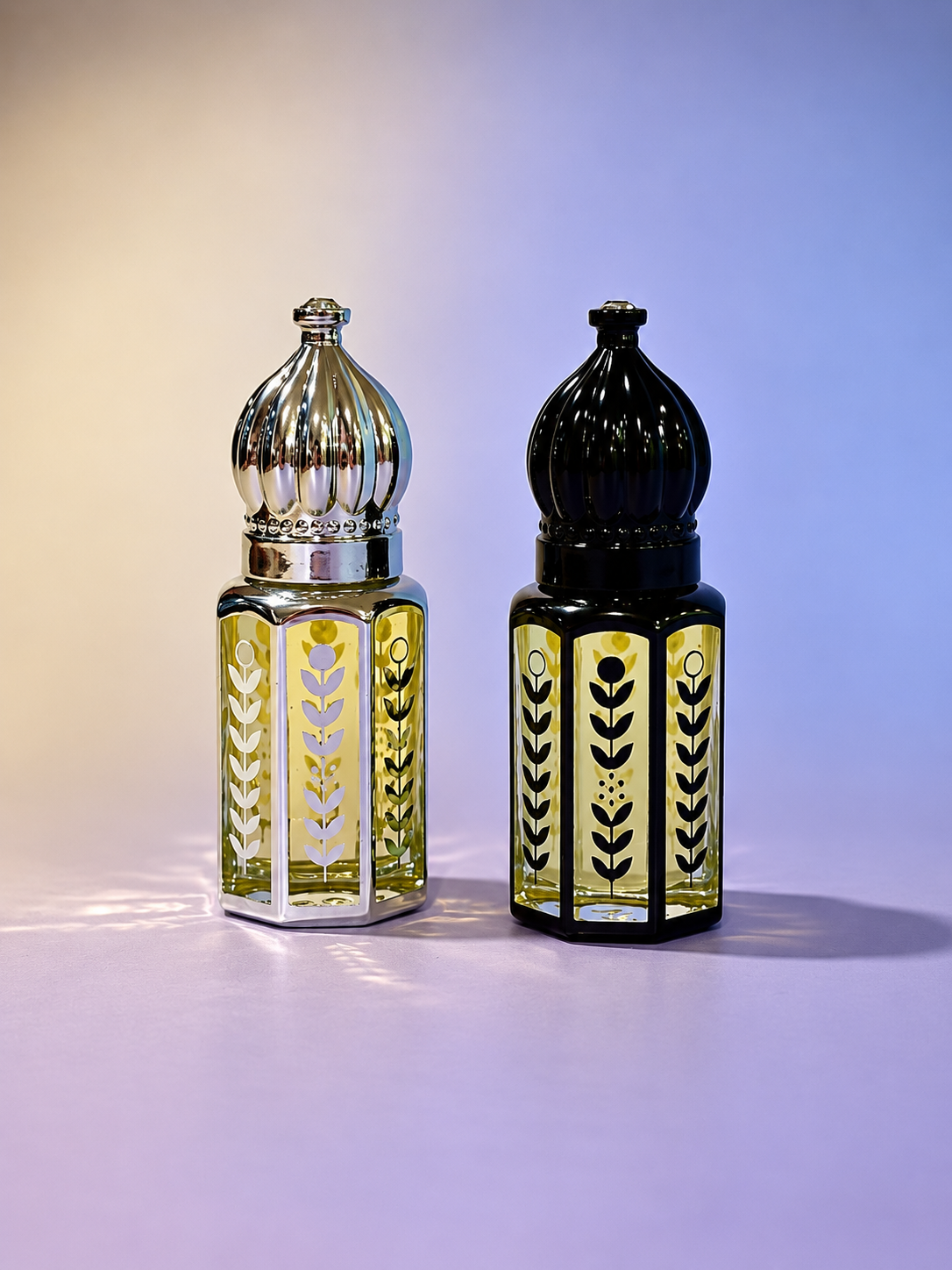 Morning and Night Duo metal-plated glass bottles with ornate dome caps — silver and black editions